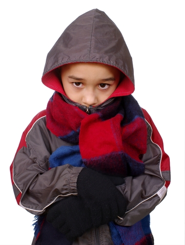 Child in warm coat and scarf